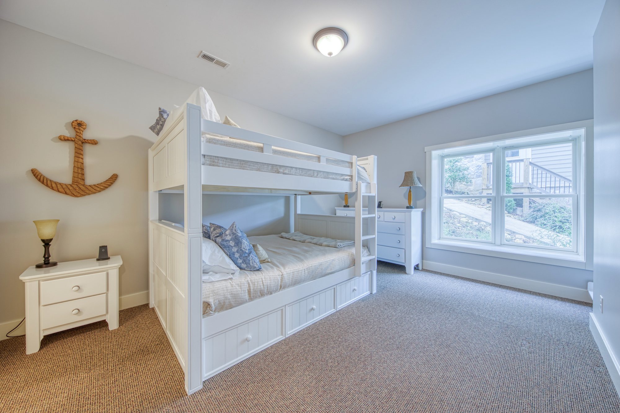 Bunk room with nautical decor