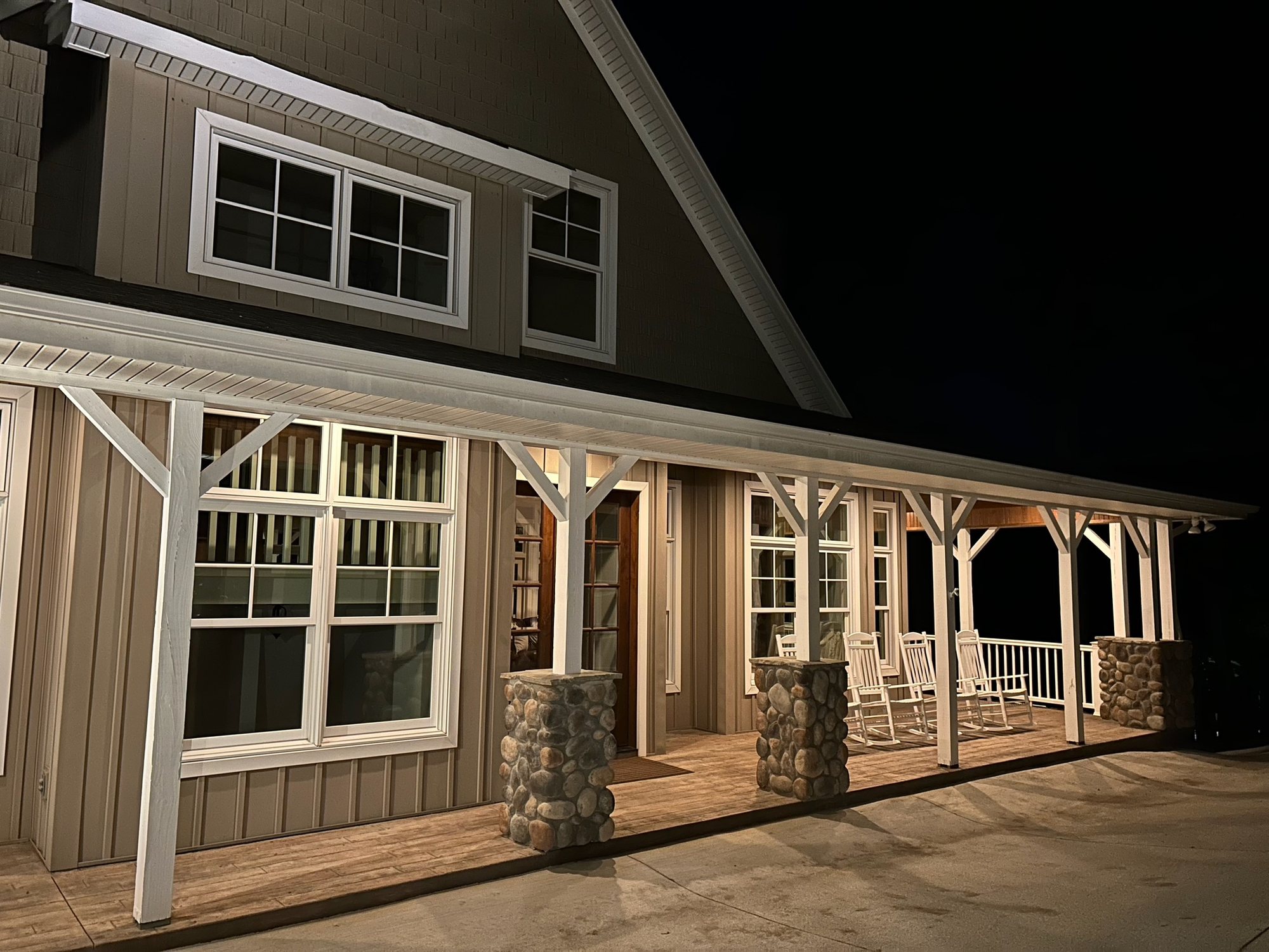 The wraparound porch, lit up at night