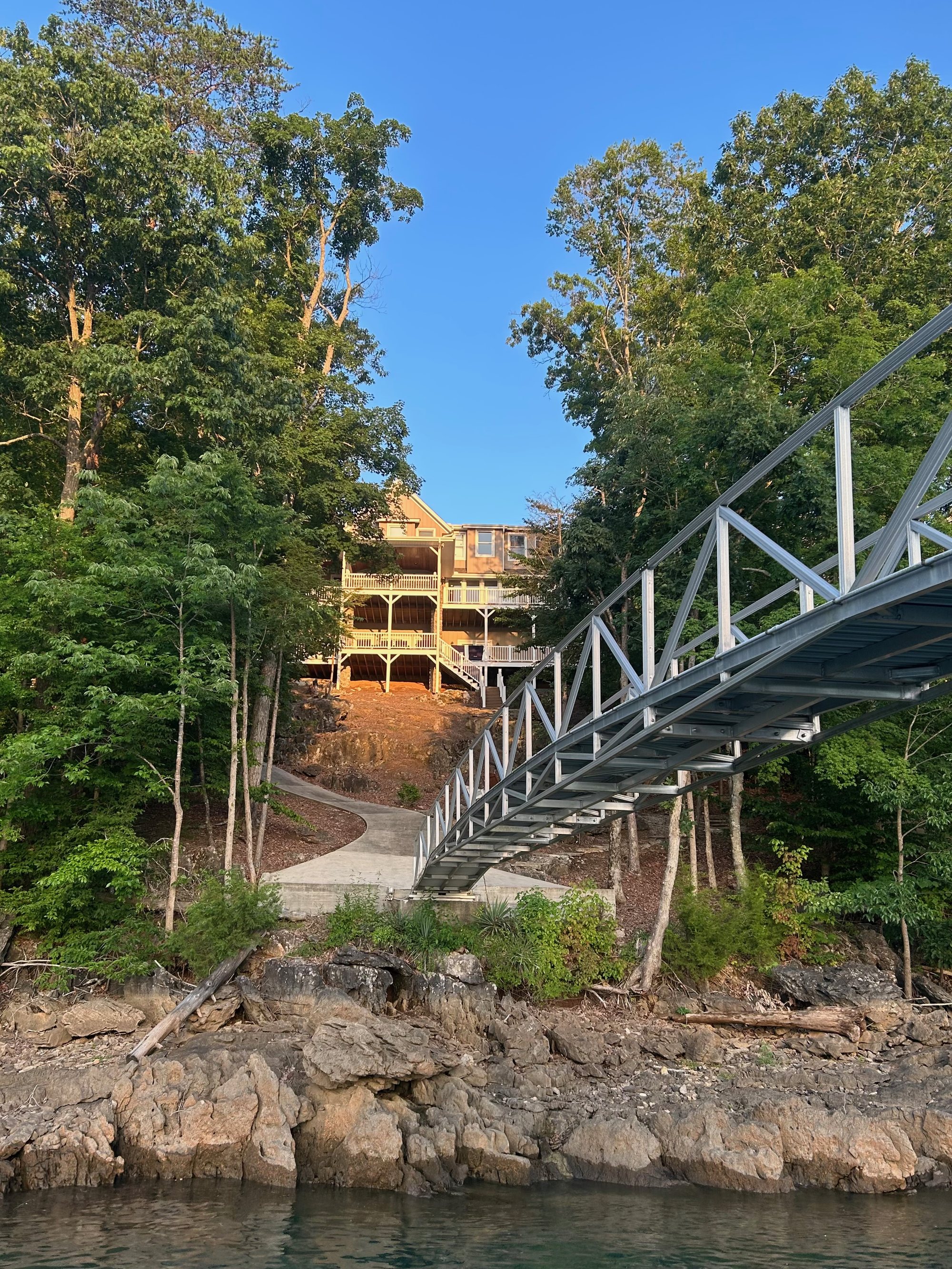 Sunset Pointe viewed from the water, with the elevated walkway leading down to the dock