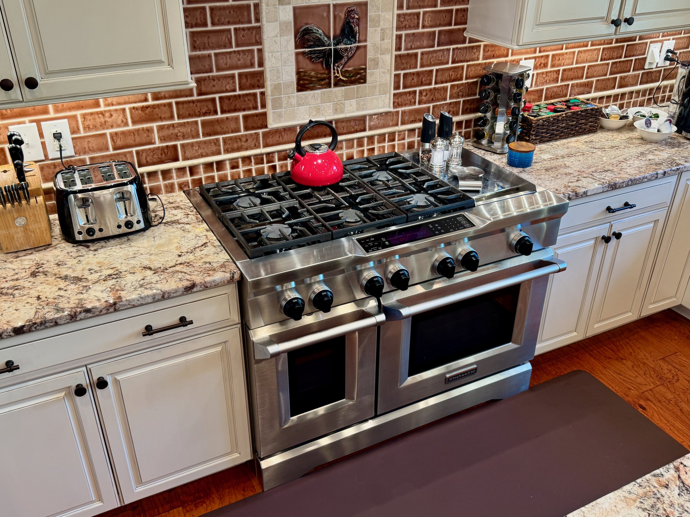 Spacious gourmet kitchen with a Wolf range