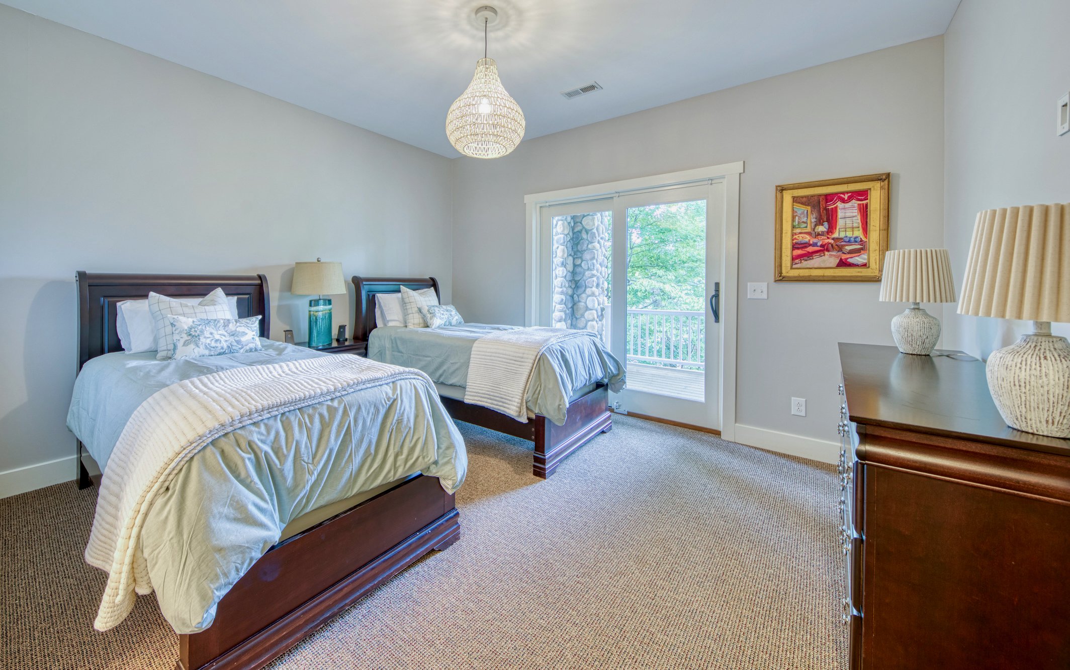 Lower-level double twin bedroom with lake views