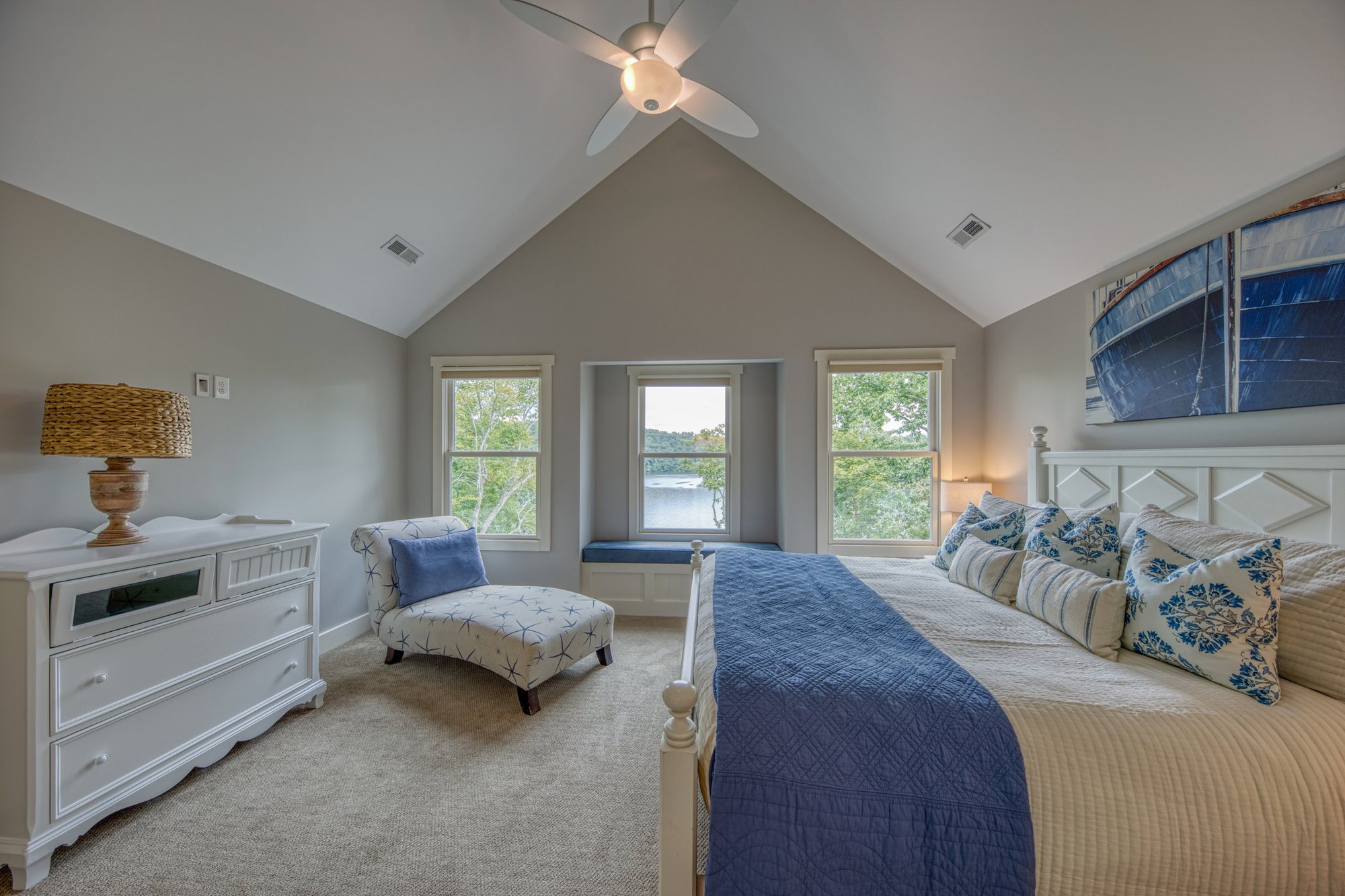 Upstairs primary suite with boat artwork