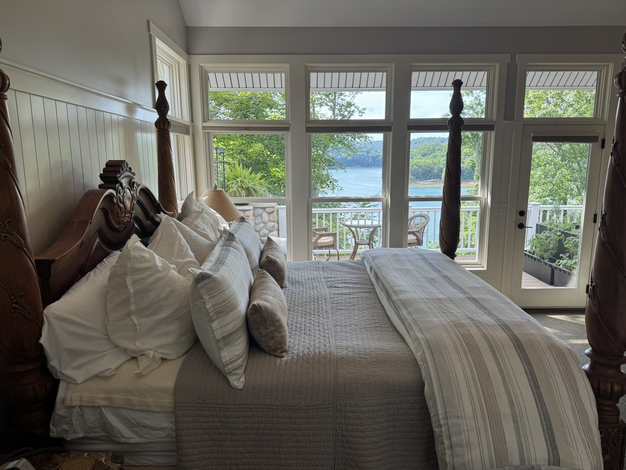 Main-level primary bedroom with lake views